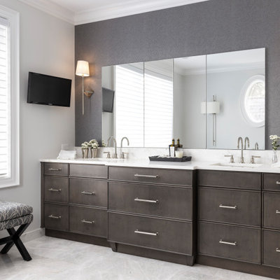 Huge transitional master white tile and marble tile marble floor, gray floor, double-sink and wallpaper bathroom photo in Detroit with a one-piece toilet, white walls, an undermount sink, marble countertops, a hinged shower door, white countertops, a built-in vanity, flat-panel cabinets and dark wood cabinets