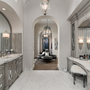 Inspiration for an expansive master bathroom in Phoenix with furniture-like cabinets, grey cabinets, a freestanding tub, an alcove shower, a one-piece toilet, multi-coloured tile, mirror tile, white walls, porcelain floors, a drop-in sink, quartzite benchtops, multi-coloured floor, a hinged shower door and multi-coloured benchtops.