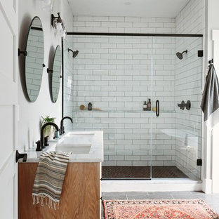 Small transitional master bathroom in Other with shaker cabinets, white tile, subway tile, porcelain floors, an undermount sink, quartzite benchtops, a hinged shower door, white benchtops, medium wood cabinets, a double shower, white walls and grey floor.