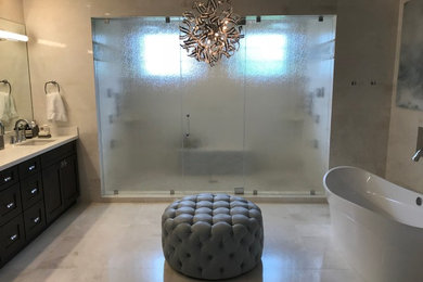 Bathroom - large contemporary master beige tile and porcelain tile porcelain tile and beige floor bathroom idea in Miami with shaker cabinets, dark wood cabinets, a two-piece toilet, gray walls, an undermount sink, quartz countertops, a hinged shower door and white countertops
