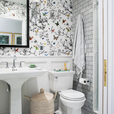 Elegant gray tile and subway tile mosaic tile floor and white floor alcove shower photo in Other with white walls and a pedestal sink