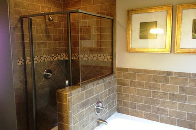 Small elegant master brown tile and ceramic tile ceramic tile bathroom photo in Austin with beige walls