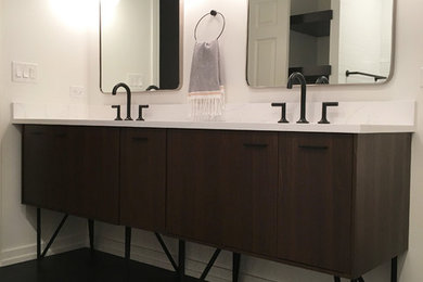 Photo of a medium sized modern ensuite bathroom in Chicago with freestanding cabinets, dark wood cabinets, a walk-in shower, a one-piece toilet, white tiles, ceramic tiles, white walls, ceramic flooring, a submerged sink, quartz worktops, black floors and an open shower.