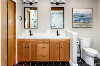 Mid-sized transitional master black and white tile and porcelain tile porcelain tile, black floor and double-sink alcove bathtub photo in Seattle with flat-panel cabinets, medium tone wood cabinets, a two-piece toilet, gray walls, an undermount sink, quartz countertops, white countertops and a built-in vanity