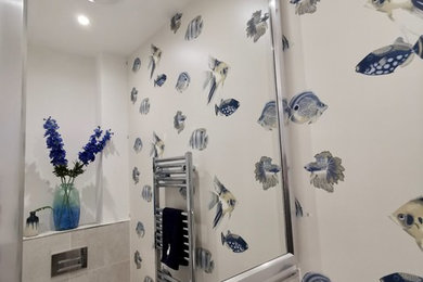 This is an example of a beach style bathroom in London.