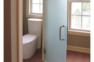 Bathroom - large master medium tone wood floor bathroom idea in New York with a one-piece toilet and beige walls