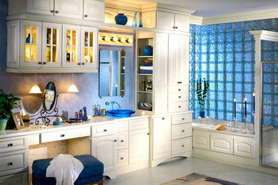 Example of a large master bathroom design in Los Angeles with white cabinets
