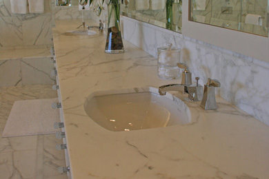 Example of a large classic master multicolored tile and stone slab marble floor double shower design in Charleston with a vessel sink, flat-panel cabinets, black cabinets, marble countertops and white walls