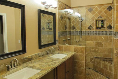 Imagen de cuarto de baño principal con lavabo bajoencimera, armarios estilo shaker, puertas de armario de madera en tonos medios, encimera de granito, ducha empotrada y paredes beige