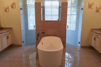 Master beige tile linoleum floor bathroom photo in Miami with raised-panel cabinets, medium tone wood cabinets, solid surface countertops and beige walls