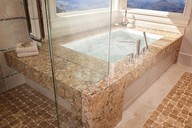 Inspiration for a large transitional master beige tile and porcelain tile ceramic tile and brown floor alcove shower remodel in Other with an undermount tub, beige walls and a hinged shower door