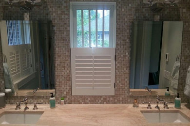 Bathroom - beige tile and mosaic tile bathroom idea in Atlanta with beige walls