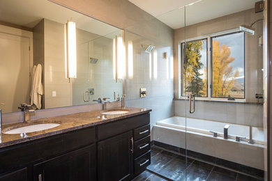 Example of a large mountain style master bathroom design in Denver with shaker cabinets, dark wood cabinets, an undermount sink and granite countertops