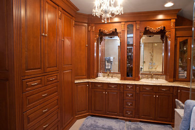 Bathroom - traditional bathroom idea in New York with raised-panel cabinets and granite countertops