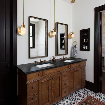 Example of an eclectic master multicolored floor bathroom design in Austin with furniture-like cabinets, dark wood cabinets, white walls and an undermount sink