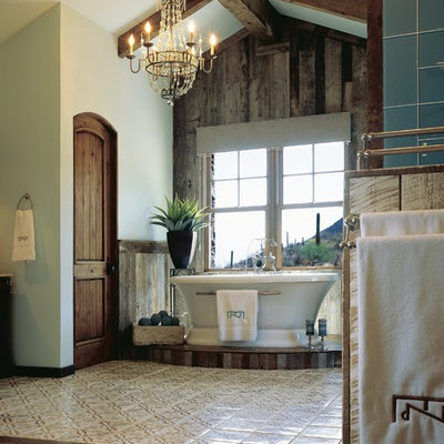 Inspiration for a large southwestern master green tile and glass tile dark wood floor freestanding bathtub remodel in Phoenix with blue walls