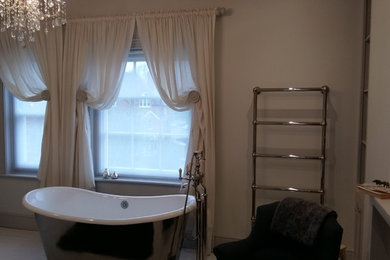 Gathered sheer curtains and roller blinds