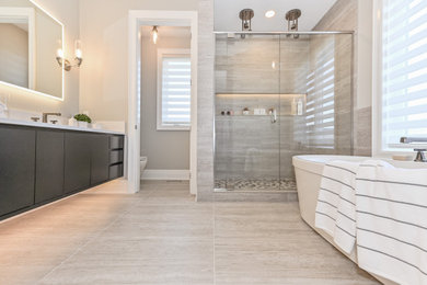 Alcove shower - large contemporary master gray tile and porcelain tile porcelain tile and gray floor alcove shower idea in Toronto with flat-panel cabinets, black cabinets and a hinged shower door