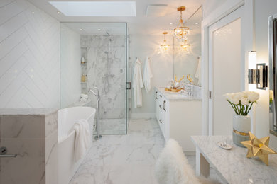 Mid-sized transitional master white tile and porcelain tile porcelain tile and white floor bathroom photo in Vancouver with raised-panel cabinets, white cabinets, a two-piece toilet, white walls, an undermount sink, marble countertops, a hinged shower door and white countertops