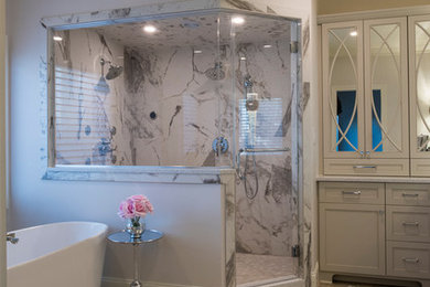 Example of a transitional master freestanding bathtub design in Raleigh with shaker cabinets, gray cabinets and a drop-in sink