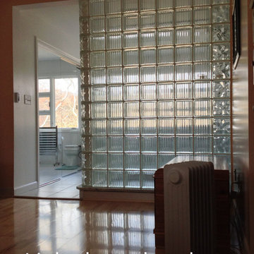 Glass block shower wall for bedroom lighting