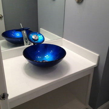 Glass counter top with vessel sink, custom cabinet