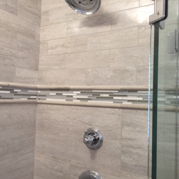 Glass tile accent band in shower
