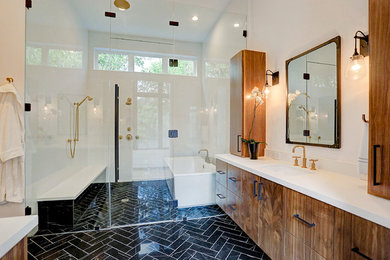 Inspiration for a large contemporary master marble floor and black floor bathroom remodel with flat-panel cabinets, medium tone wood cabinets, a two-piece toilet, white walls, an undermount sink, quartzite countertops, a hinged shower door and white countertops