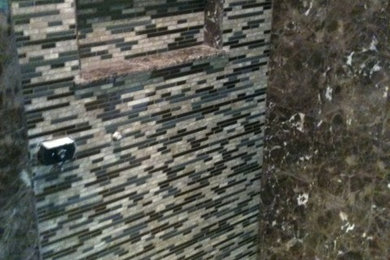 Example of a mid-sized eclectic master brown tile and mosaic tile marble floor double shower design in New York