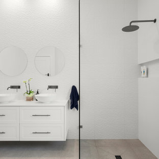 Design ideas for a mid-sized contemporary kids bathroom in Melbourne with shaker cabinets, white cabinets, an open shower, white tile, ceramic tile, white walls, ceramic floors, engineered quartz benchtops, grey floor, an open shower, white benchtops, a niche, a double vanity and a floating vanity.