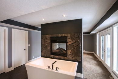 Inspiration for a transitional freestanding bathtub remodel in Calgary