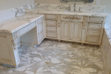 Example of a classic bathroom design in Los Angeles with marble countertops