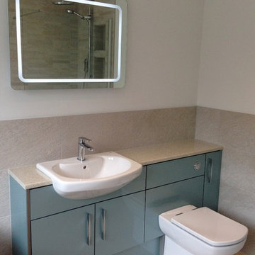 Gloss finish fitted bathroom furniture in Azure colourway