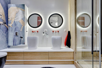 Example of a trendy white floor bathroom design in Calgary with flat-panel cabinets, light wood cabinets, blue walls, a vessel sink and white countertops