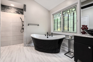 Inspiration for a contemporary master black and white tile and ceramic tile porcelain tile and white floor bathroom remodel in Other with flat-panel cabinets, black cabinets, white walls, a vessel sink, quartz countertops and multicolored countertops
