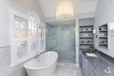 Bathroom - large traditional master gray tile and marble tile marble floor and gray floor bathroom idea in Boston with beaded inset cabinets, gray cabinets, a two-piece toilet, gray walls, a drop-in sink, quartz countertops, a hinged shower door and gray countertops