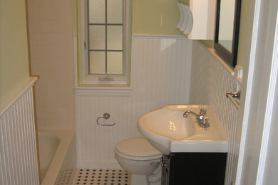 Bathroom - small traditional black and white tile and porcelain tile bathroom idea in Cincinnati with black cabinets