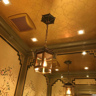 This is an example of a small traditional 3/4 bathroom in New York with furniture-like cabinets, green cabinets, a two-piece toilet, multi-coloured walls, mosaic tile floors, an undermount sink and engineered quartz benchtops.