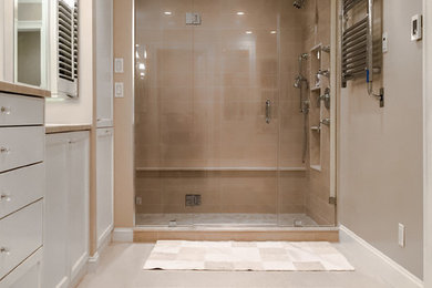 Example of a mid-sized trendy 3/4 brown tile and porcelain tile gray floor alcove shower design in New York with recessed-panel cabinets, gray cabinets, beige walls, a hinged shower door and beige countertops