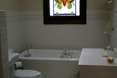 Example of a mid-sized ornate 3/4 white tile and ceramic tile mosaic tile floor claw-foot bathtub design in Atlanta with a pedestal sink, shaker cabinets, white cabinets, granite countertops and yellow walls