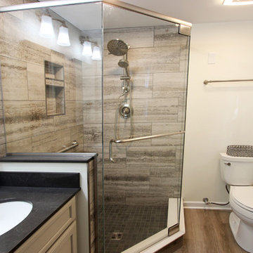 Gray Master Bathroom with Tiled Shower and Barn Door