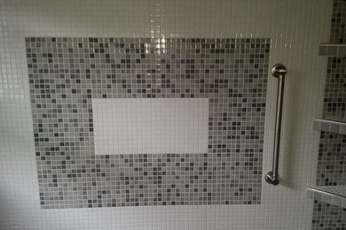 Traditional bathroom in Cedar Rapids with an alcove shower, grey tiles, white tiles and mosaic tiles.
