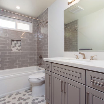 Gray tones playfulness. A kids bathroom in Oak park.