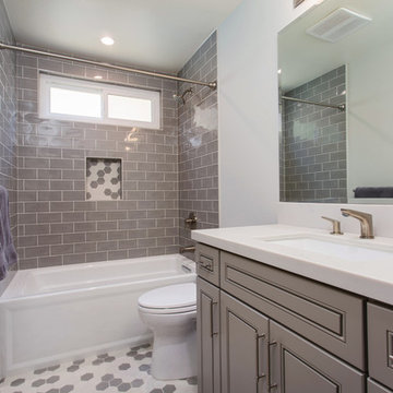 Gray tones playfulness. A kids bathroom in Oak park.
