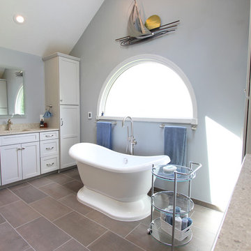 Gray Vanity with Freestanding Tub and Tiled Walkin Shower