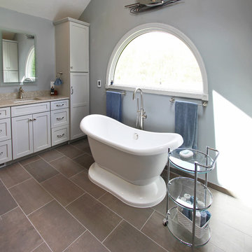 Gray Vanity with Freestanding Tub and Tiled Walkin Shower