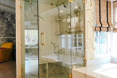 Example of a mid-sized trendy master beige tile marble floor and white floor bathroom design in Los Angeles with shaker cabinets, white cabinets, a one-piece toilet, beige walls, marble countertops, white countertops, an undermount tub and an undermount sink
