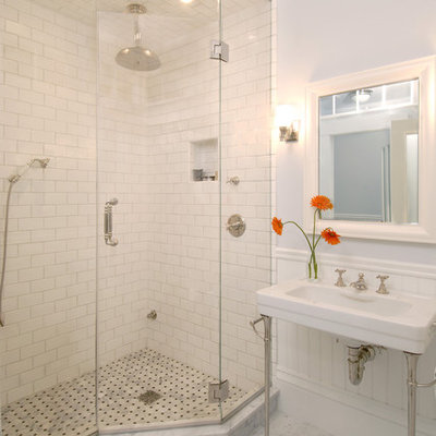 Elegant subway tile marble floor corner shower photo in Boston with a console sink