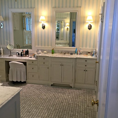 Large elegant master white tile and stone tile marble floor alcove bathtub photo in Cincinnati with shaker cabinets, white cabinets, multicolored walls, an undermount sink and marble countertops