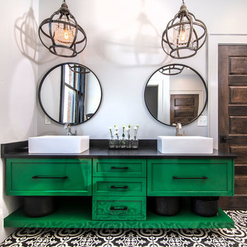 Green vanity with black and white tile floor
